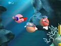 Kirby swimming with two Blippers in Kirby for Nintendo GameCube