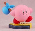 Kirby 30th Anniversary Edition Nendoroid wtih the Classic face holding a bindle stick