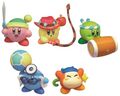 Gashapon figurines from the "Kirby Battle Royale" merchandise line, featuring a yellow Whip Kirby