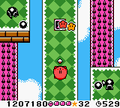 Kirby takes a short break from the auto-scrolling in a Jump Hole.