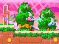Kirby and Dedede hop over bumpy terrain.