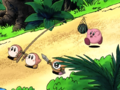 Kirby being lured by a watermelon in a net carried by King Dedede's soldiers