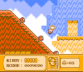 Kirby jumps at three Waddle Dees walking down a slope.