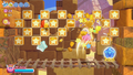 Kirby uses Hi-Jump to break through a series of blocks.