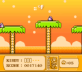 Kirby flies over the high treetops using Tornado to reach the end of the stage.