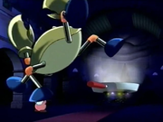 Cook Kirby shows his unusual strength by lifting Garnie up by the foot.