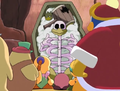 The casket is opened to reveal a Dedede-like skeleton.
