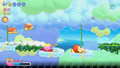 Kirby cuts one of the vine platforms while attacking his foes.