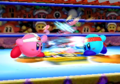 Kirby Fighters Deluxe credits picture, featuring two Fighter Kirbys fighting each other in Dedede Arena