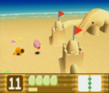 Kirby stumbles onto a sandcastle along his path on the beach