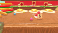 Kirby approaching a pile of five strawberries on the Hamburgers course
