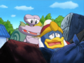 Escargoon pulls King Dedede out of the rubbish heap.