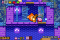 Kirby attacks a Big Waddle Dee with the Hammer ability in Moonlight Mansion.