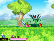 Sword Kirby cuts some grass, while a Waddle Dee watches