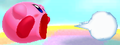 Kirby shoots out an air bullet in Kirby: Triple Deluxe.