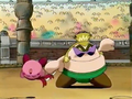 Kirby is tossed about by the sumo figure.